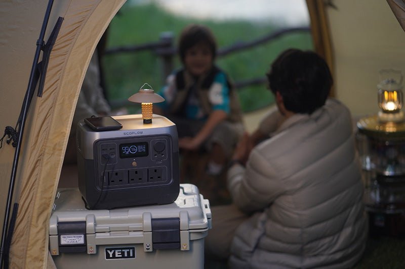 Picture of a family in a tent using an EcoFlow portable power station