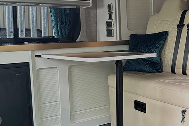 cream and white interior of a converted Vauxhall Vivaro campervan