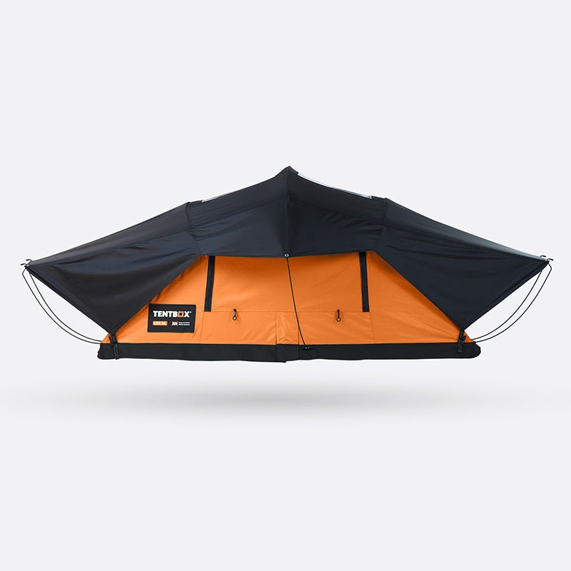 TentBox Lite XL roof tent, black rainfly over orange ripstop polyester shell, closed for travel.