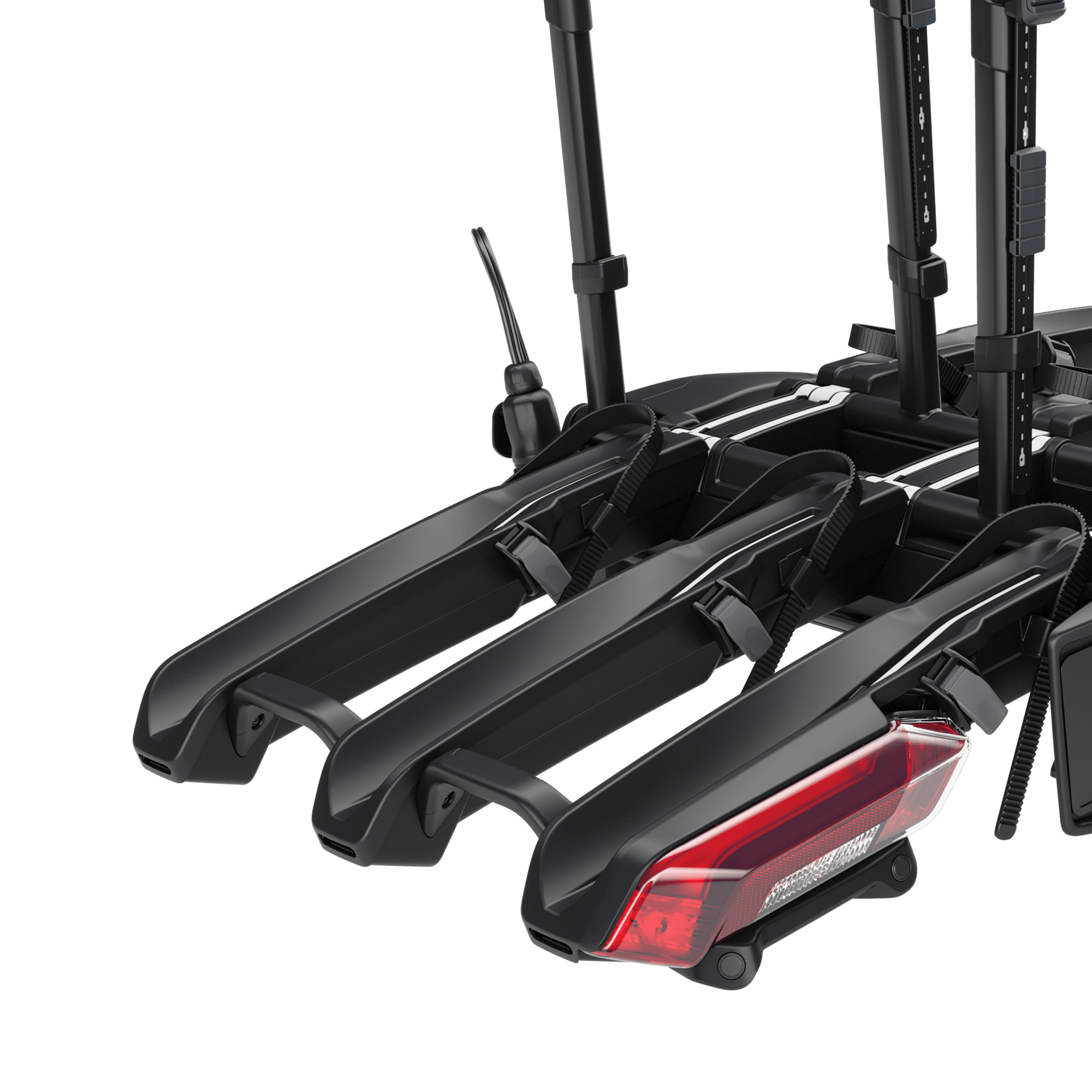 Black Thule Epos ParkSecure 3B RHD towbar bike carrier with red taillight, designed for three bikes.