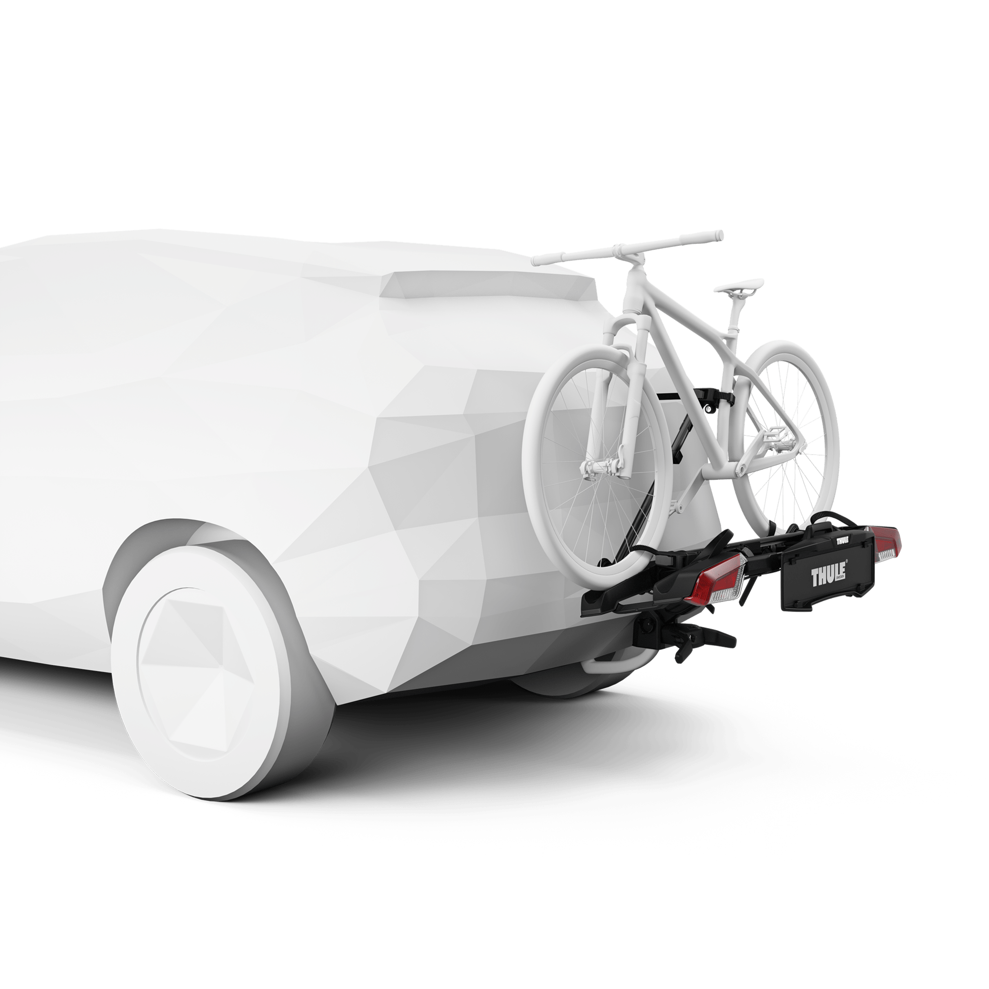 Thule OutPace 2-bike rack, black and silver, mounted on a white car's towbar, holding one white bicycle.