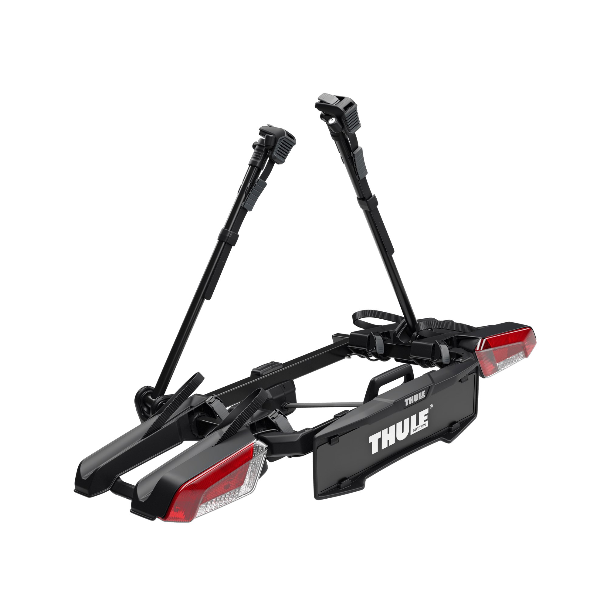 Black Thule OutPace 2-bike towbar rack with red taillights and adjustable arms.