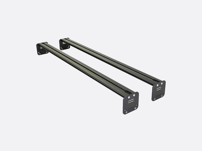 Two black powder-coated aluminium TentBox Cargo roof bars with a low-profile design.