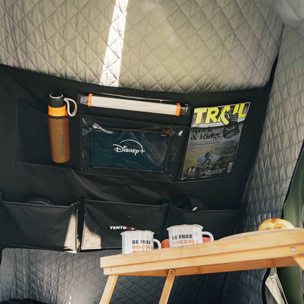 Quilted grey thermal kit lining the interior of a TentBox Cargo, with a black multi-pocket organizer.