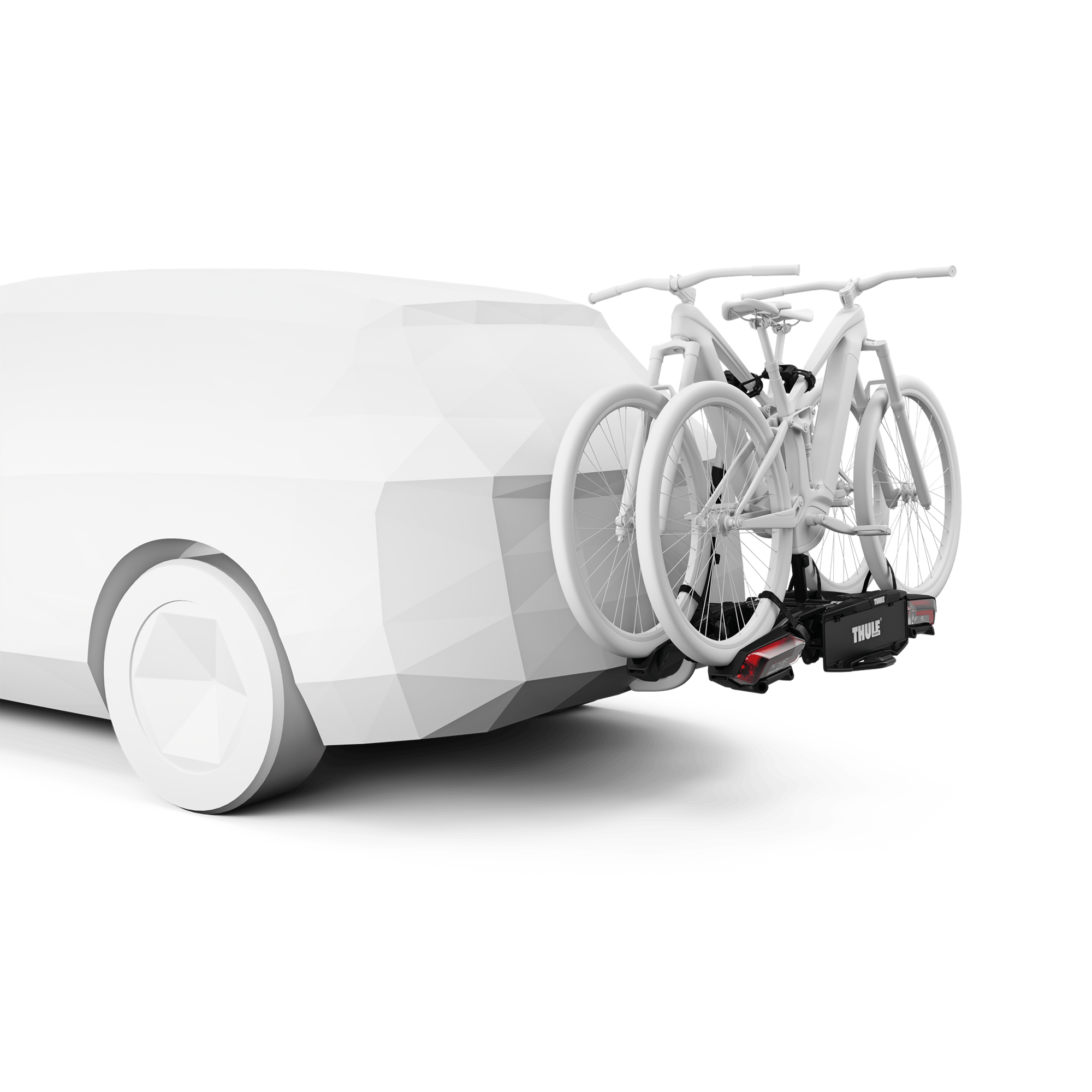 Black Thule Epos ParkSecure 2B RHD towbar bike carrier holding two white bikes on a white car.