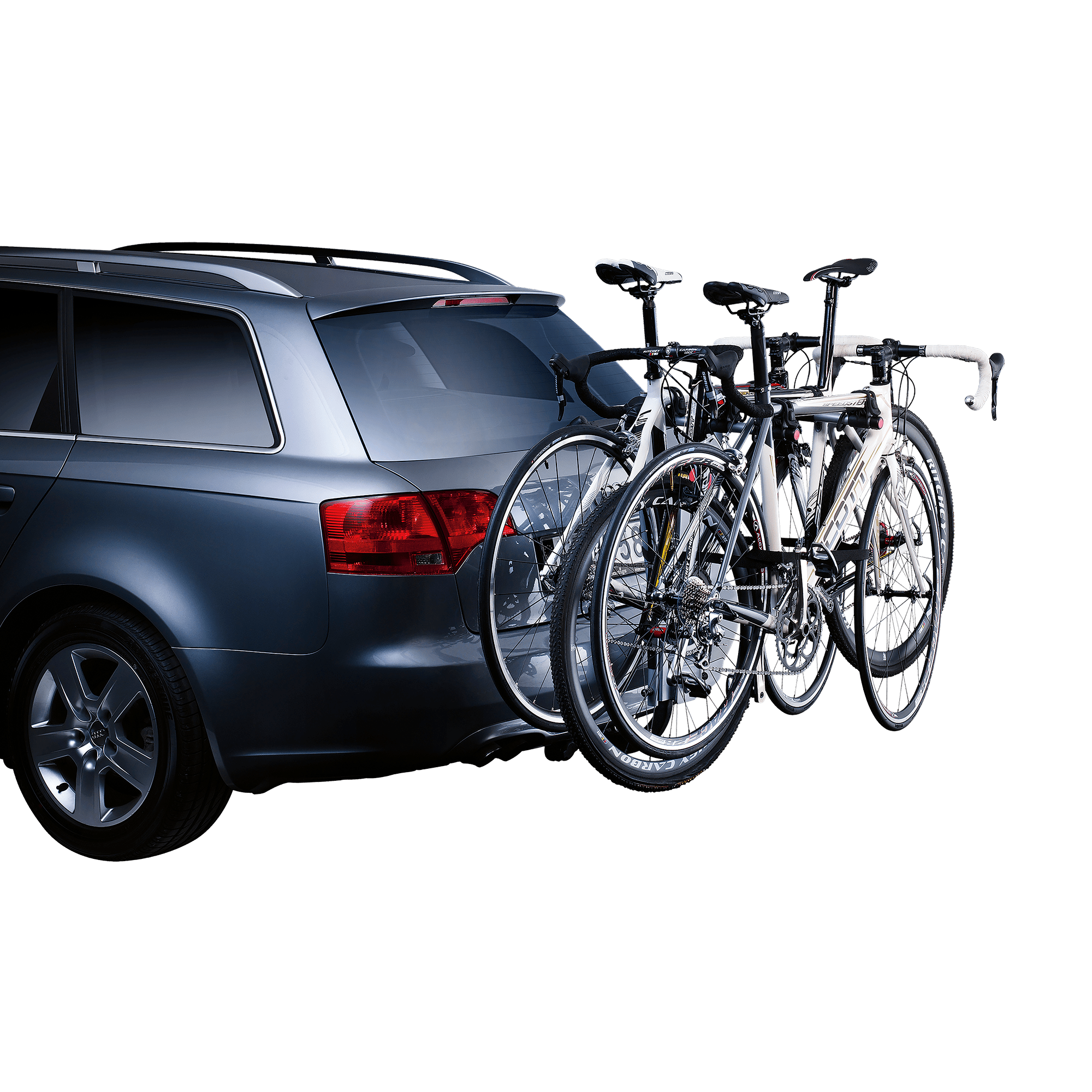 Dark gray car with a Thule HangOn 3 tilt towbar bike rack carrying three white road bikes.