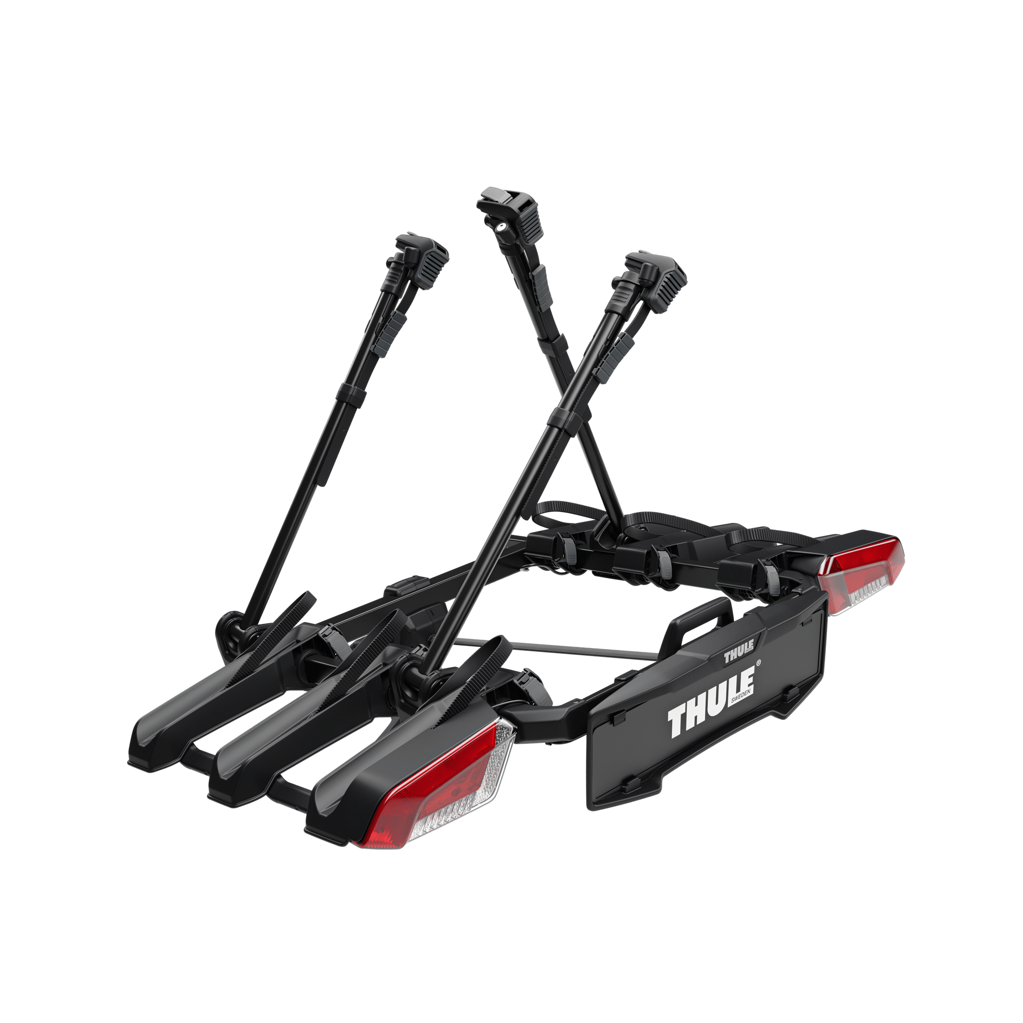 Black Thule OutPace 3-bike platform rack with red taillights and adjustable bike arms.