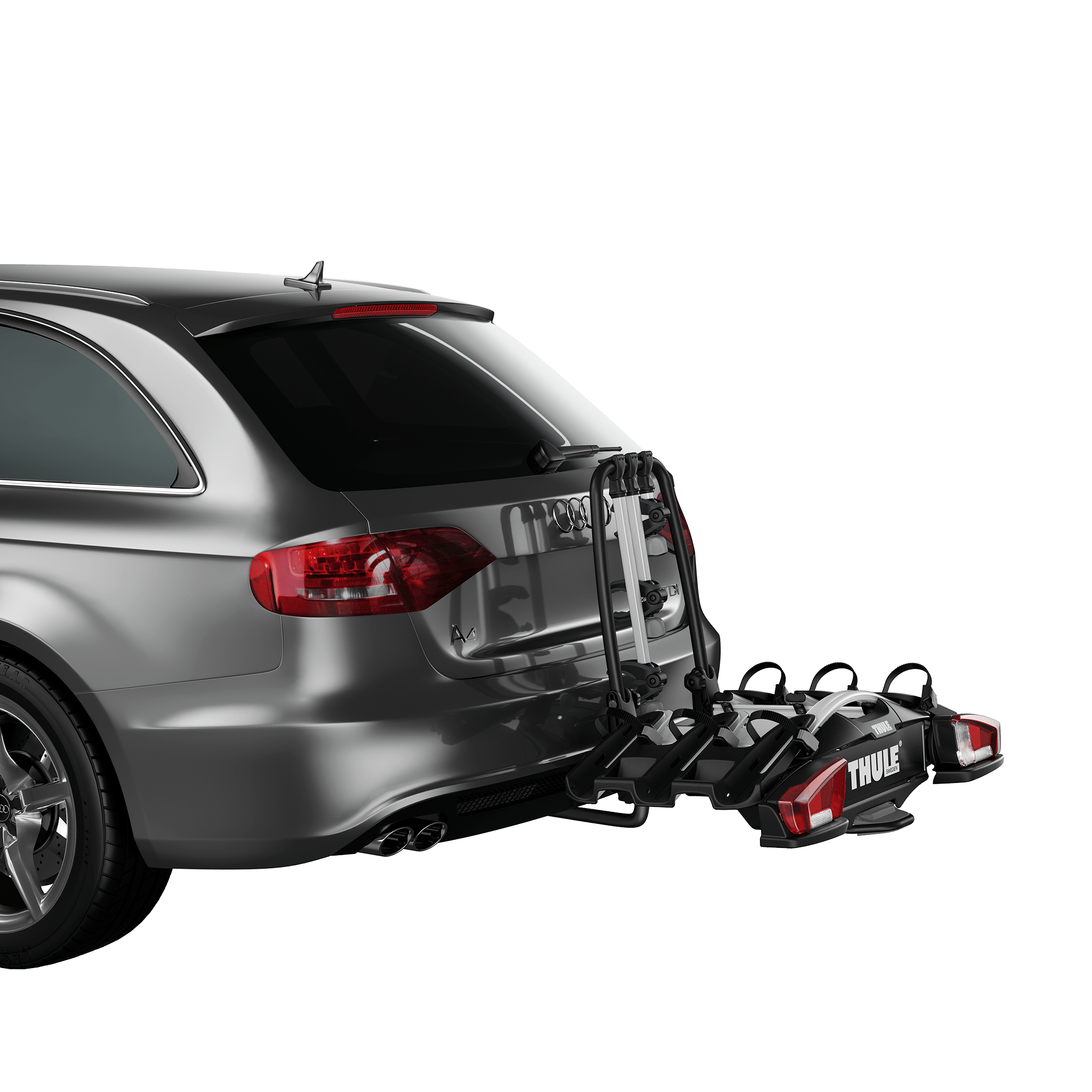 Thule VeloCompact 3 towbar bike rack in black and silver, mounted on a gray car's rear.