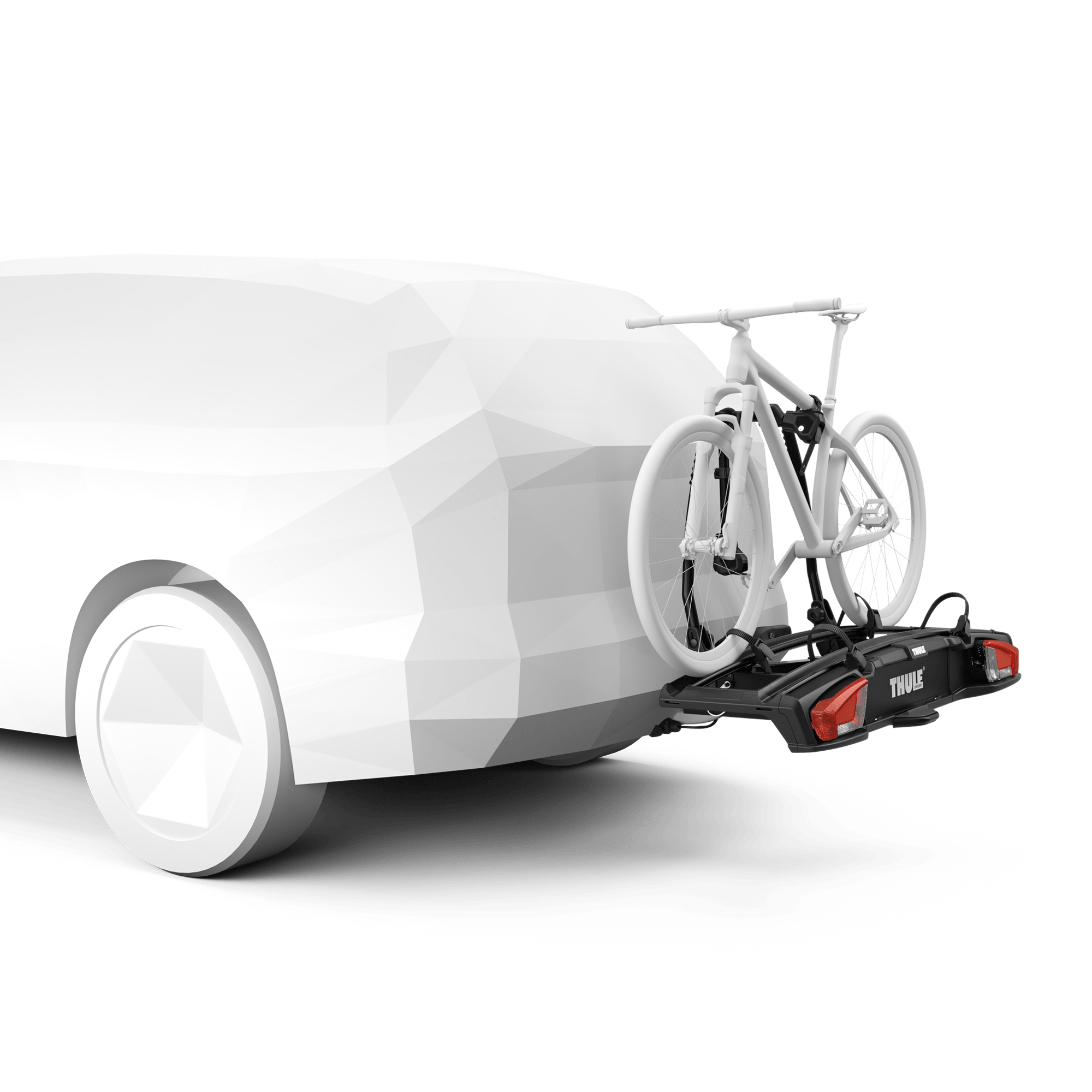 Thule VeloSpace 3 towbar bike rack in black, carrying a white bicycle on a white car.