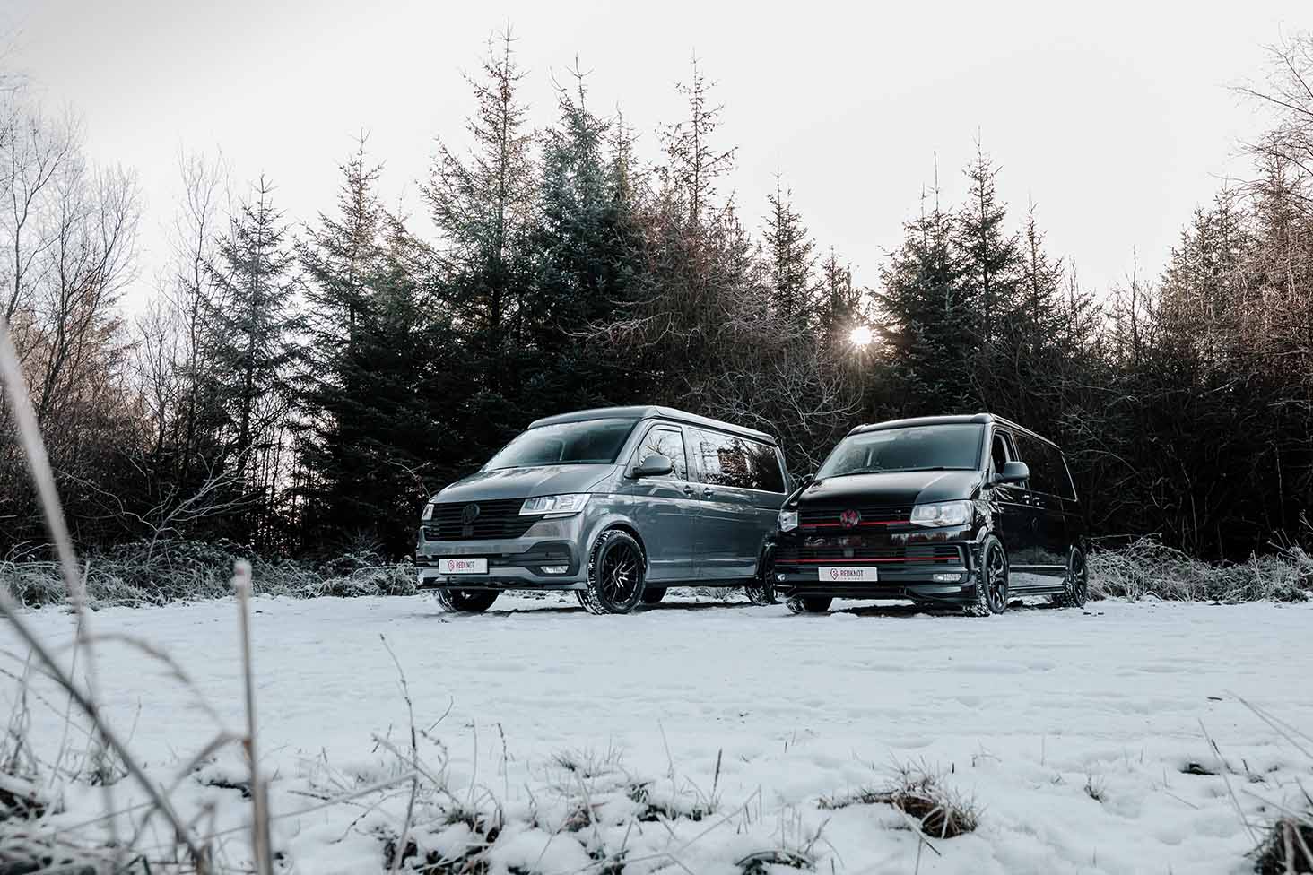 Two Volkswagen campers in the snow